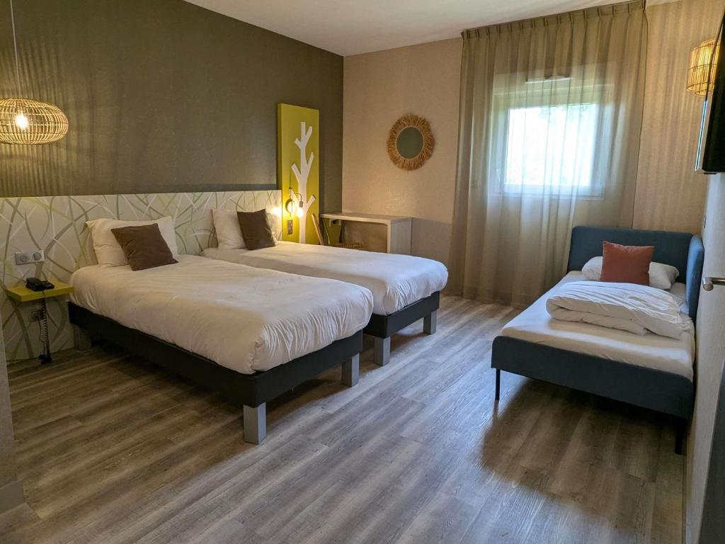 Postel nebo postele na pokoji v ubytování ibis Styles Contres-Cheverny