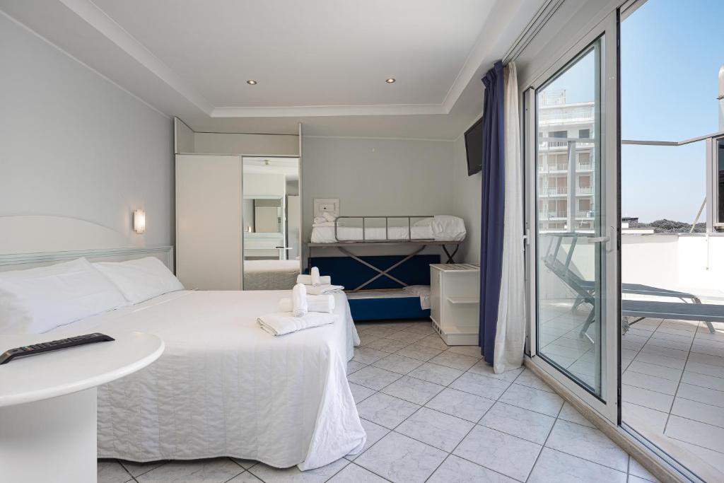 Postel nebo postele na pokoji v ubytování Hotel Oriente