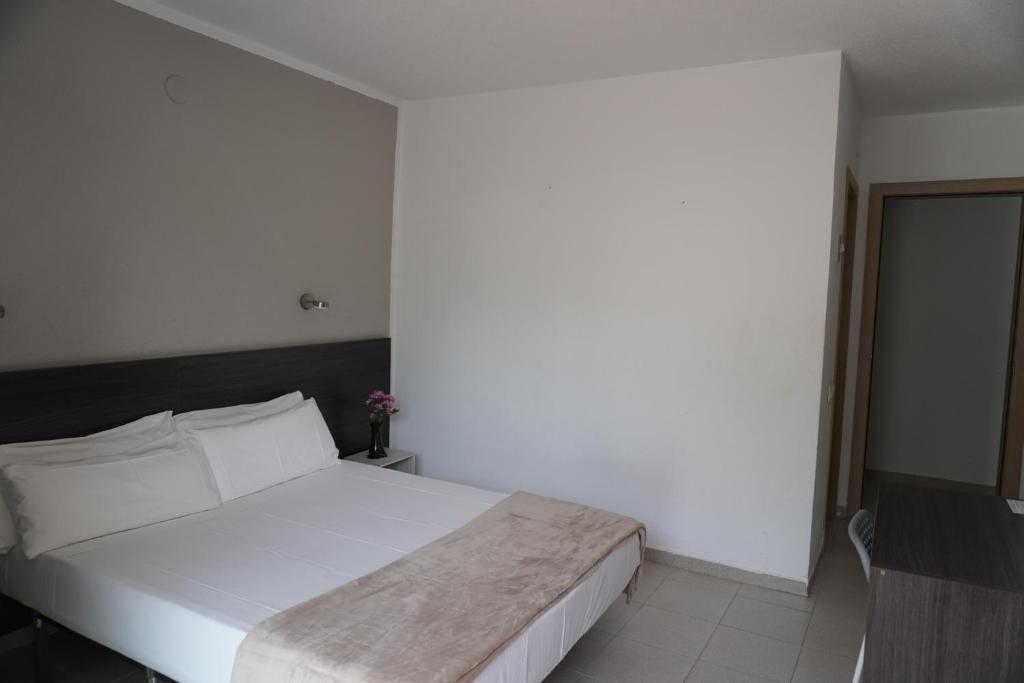 Postel nebo postele na pokoji v ubytování Hotel Ram Rooms Tahiti