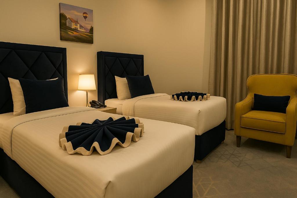 Letto o letti in una camera di Saraya Palace Hotel