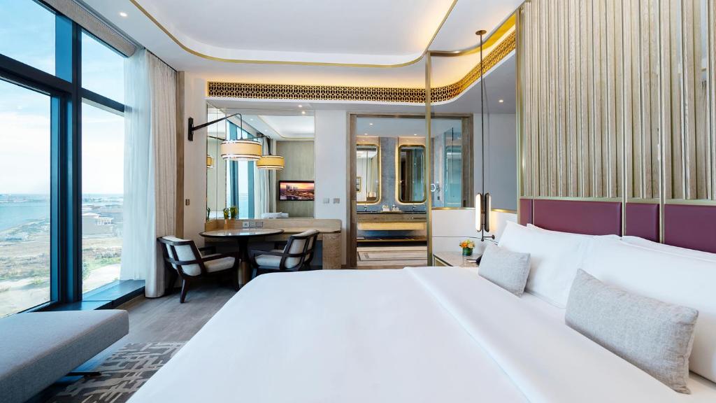 Postel nebo postele na pokoji v ubytování NUSTAR Hotel Cebu
