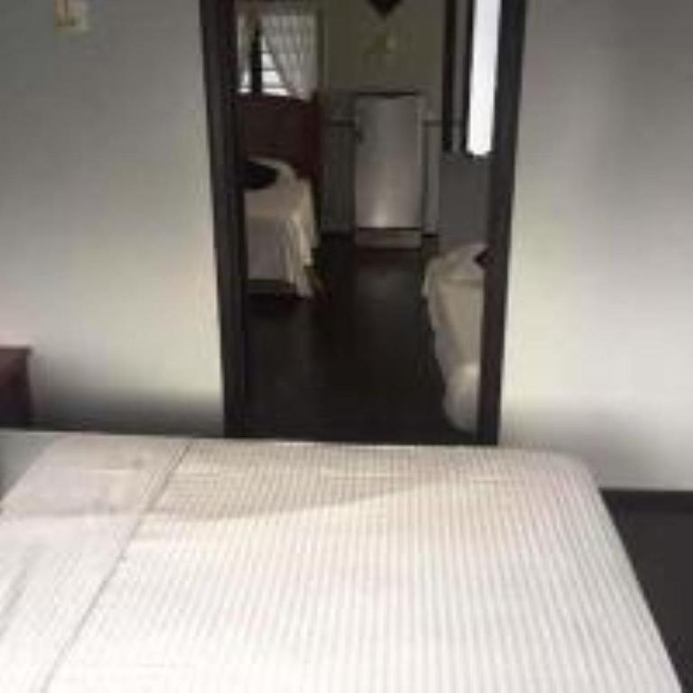 Postel nebo postele na pokoji v ubytování Nipah Bay Villa