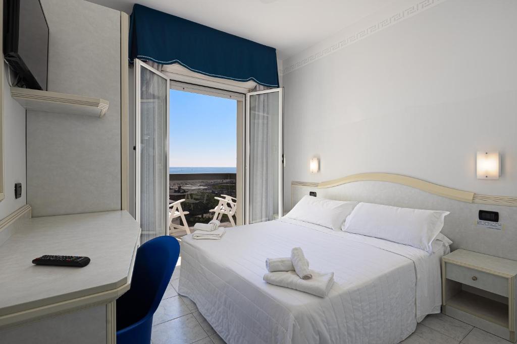 Postel nebo postele na pokoji v ubytování Hotel Oriente