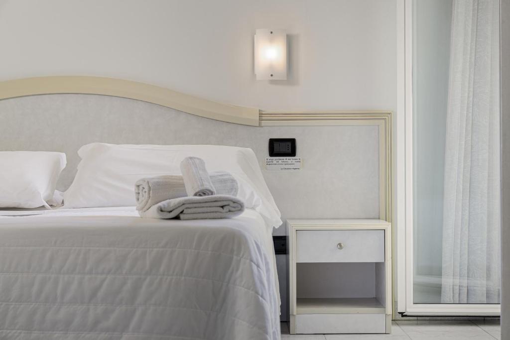 Postel nebo postele na pokoji v ubytování Hotel Oriente