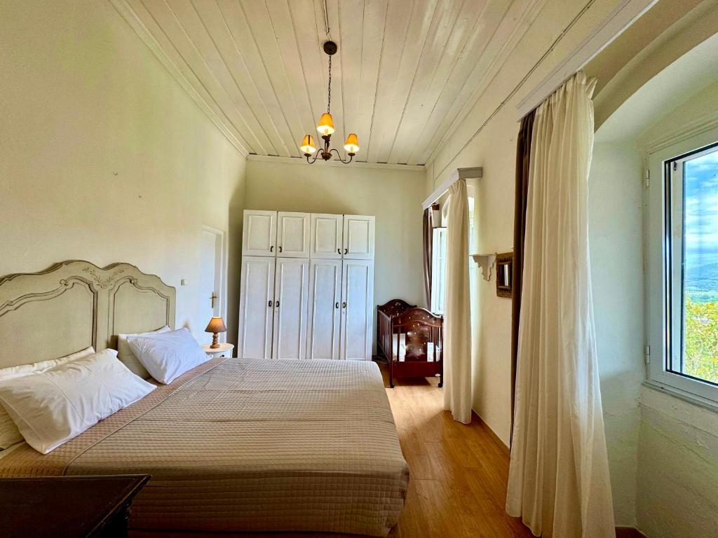 Postel nebo postele na pokoji v ubytování Marcora's Historical Estate