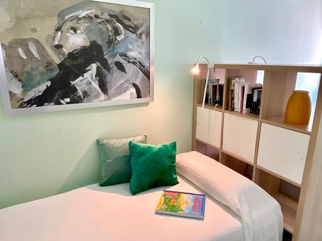 a room with a bed and a painting on the wall at Las Olas Suite - Bajamar in Bajamar
