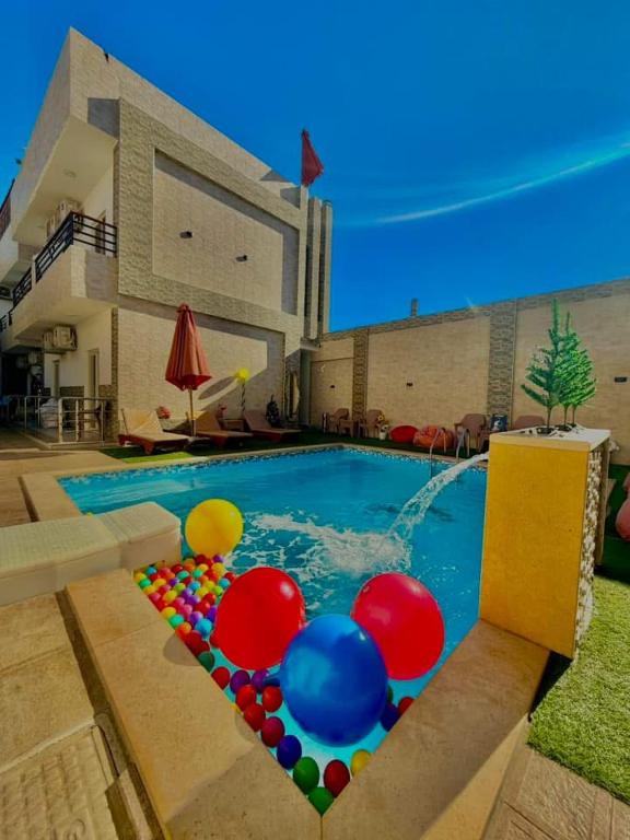 a swimming pool with a bunch of balloons in it at King house hotel dahab in Dahab
