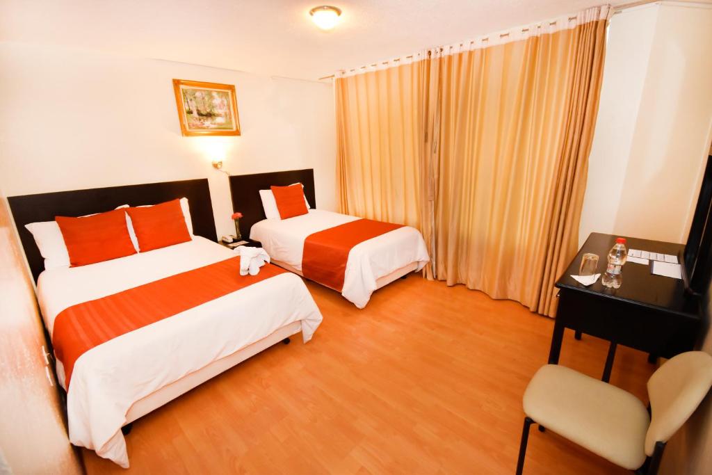 Postel nebo postele na pokoji v ubytování Hotel Montecarlo