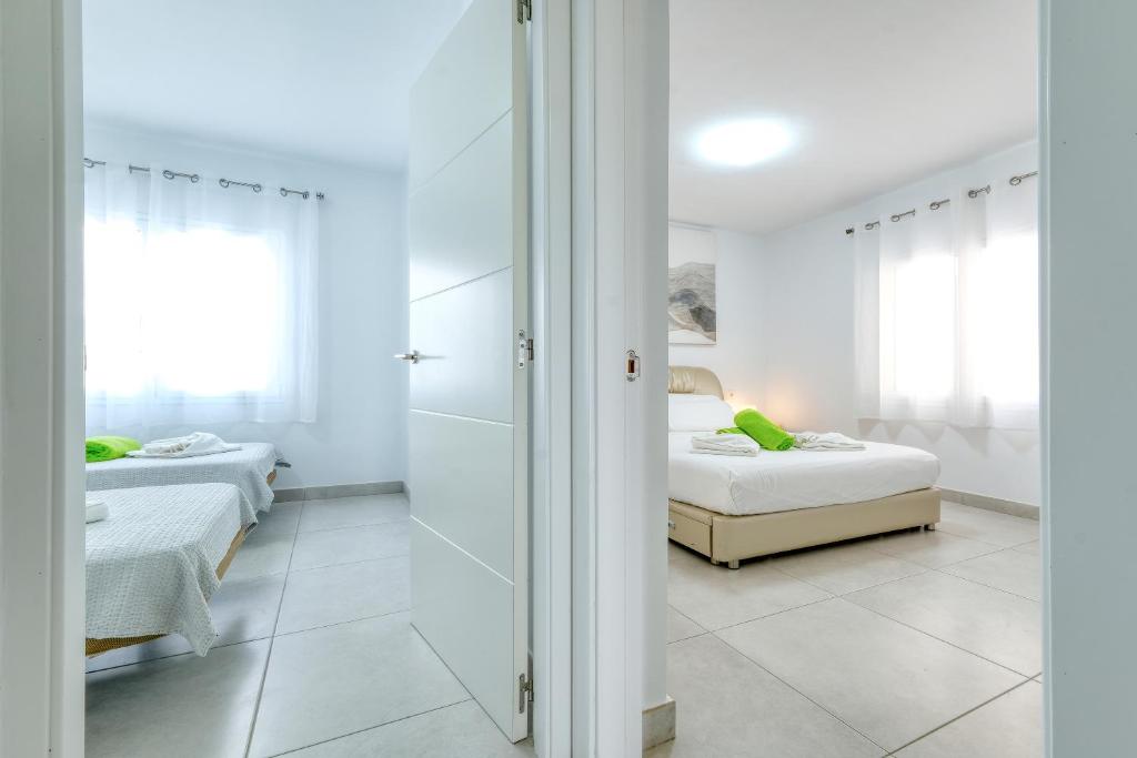 Posteľ alebo postele v izbe v ubytovaní Monarca House, Senator