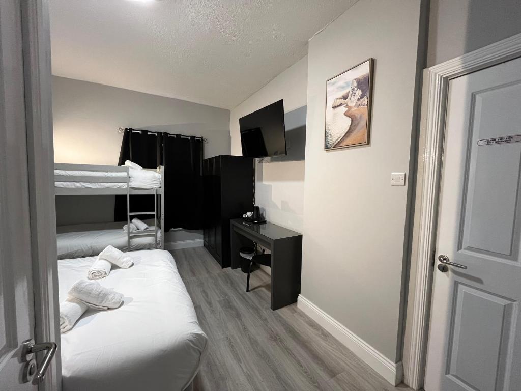 Postel nebo postele na pokoji v ubytování Shamrock Inn