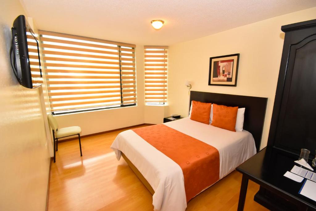 Postel nebo postele na pokoji v ubytování Hotel Montecarlo