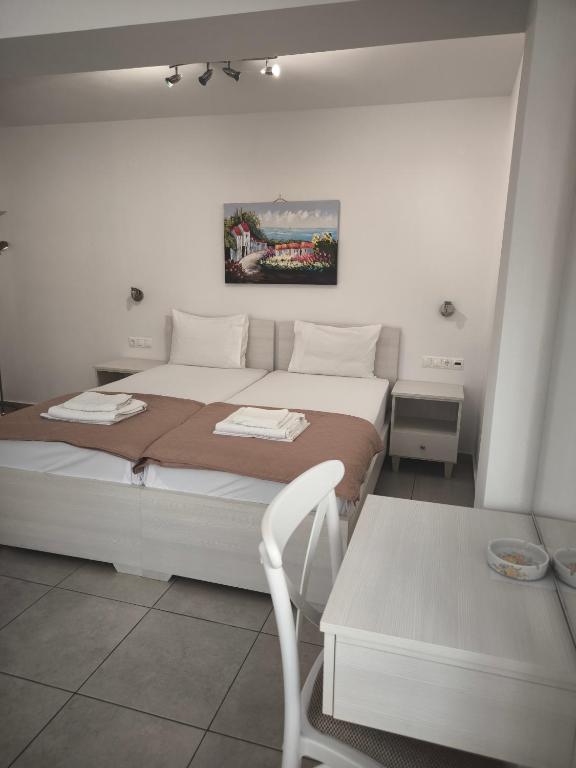 Postel nebo postele na pokoji v ubytování Alexia Rooms