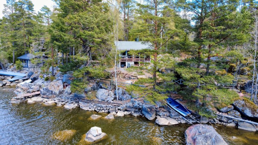 an aerial view of a house next to a river at Ahlaistentupa in Pori