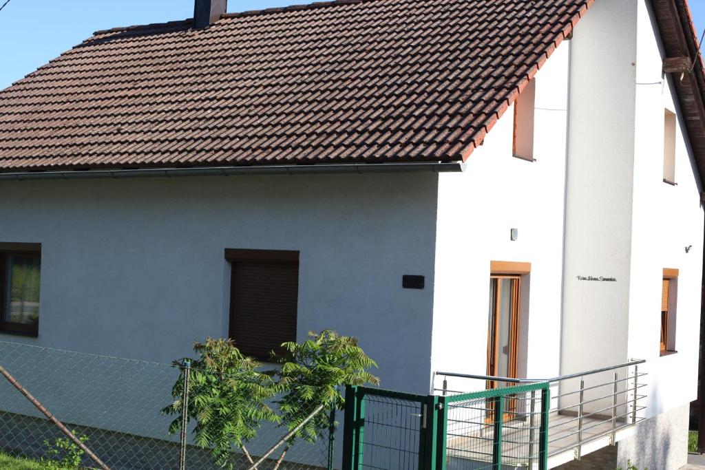 a white house with a brown roof at Relax House Samardzic in Ličko Petrovo Selo