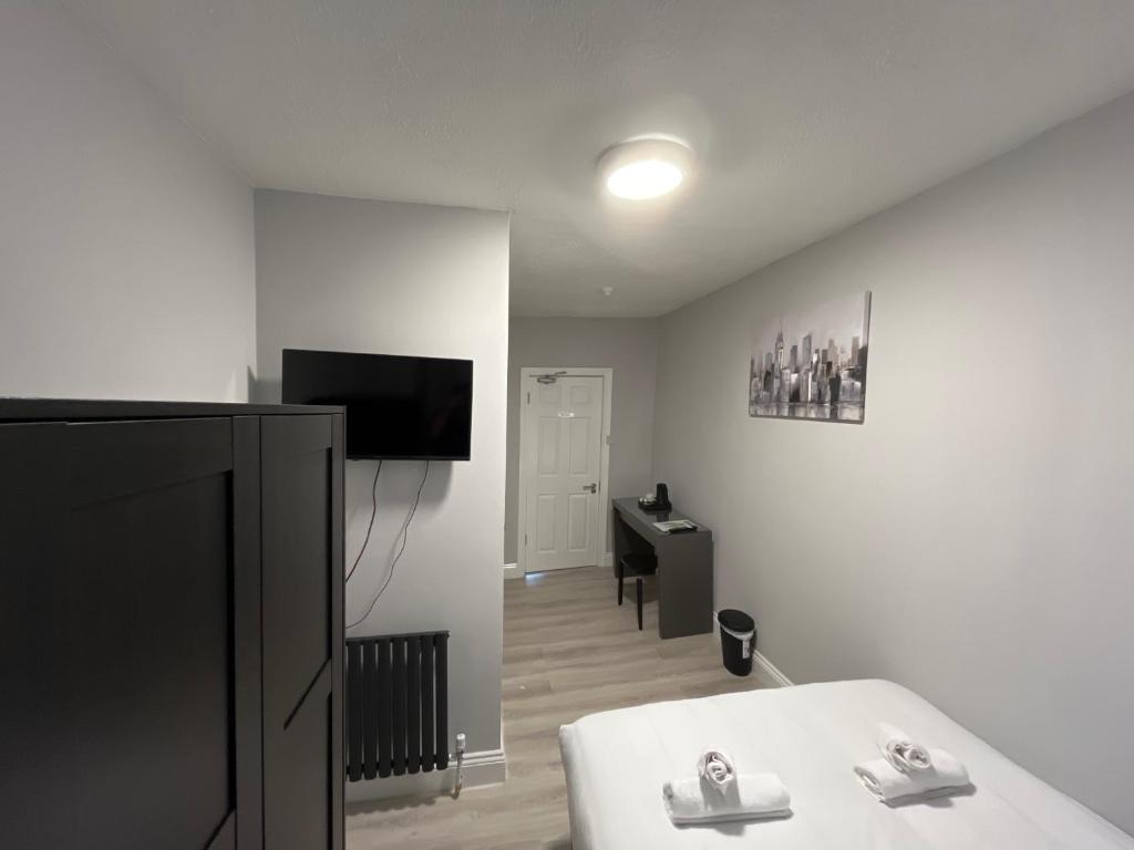 Postel nebo postele na pokoji v ubytování Shamrock Inn