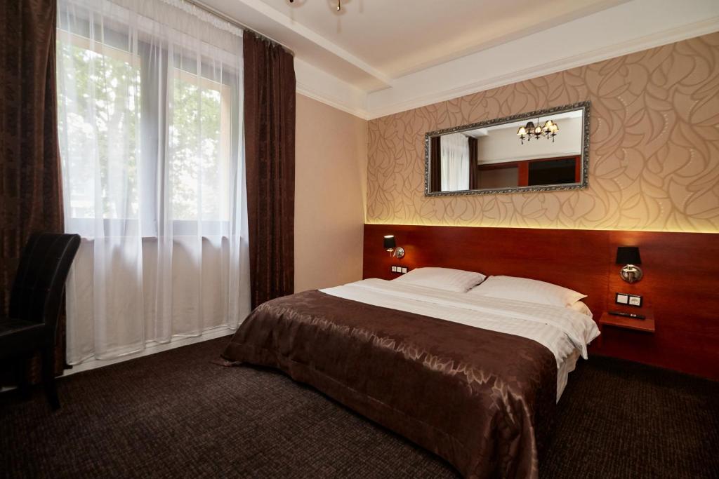 Postel nebo postele na pokoji v ubytování Hotel&Spa Kameleon