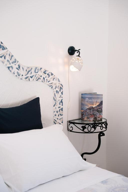Postel nebo postele na pokoji v ubytování B&b DORMIDAME'