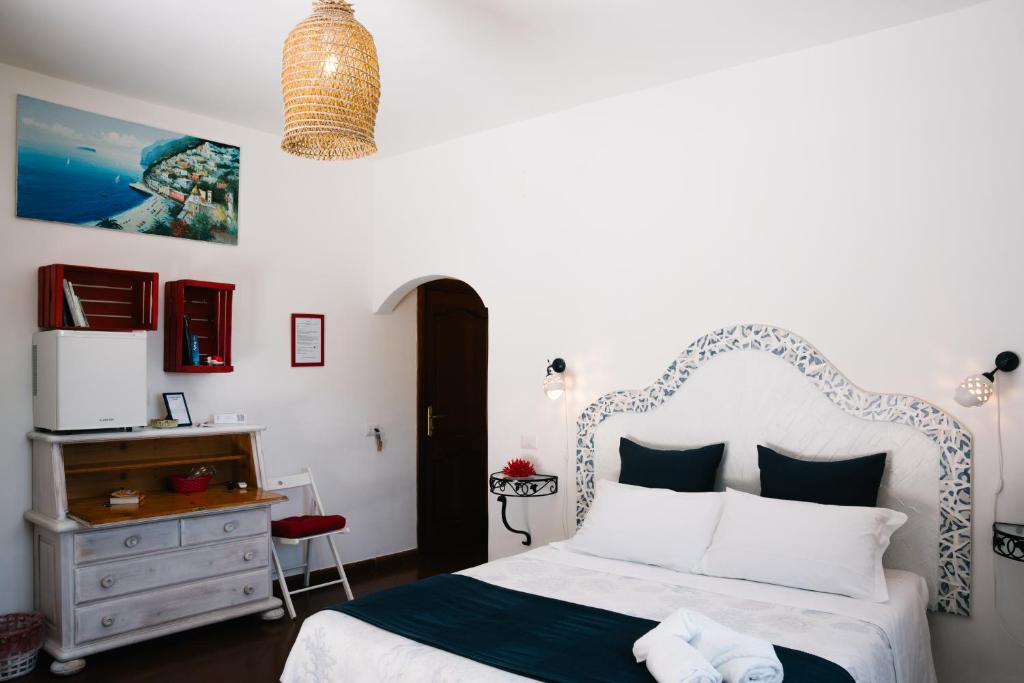 Postel nebo postele na pokoji v ubytování B&b DORMIDAME'