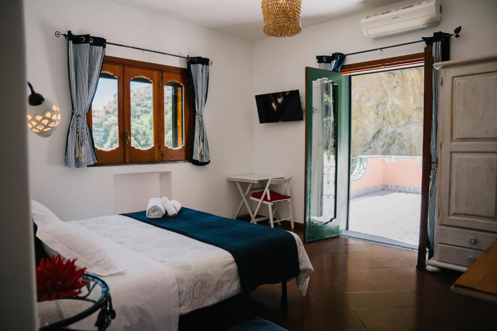 Postel nebo postele na pokoji v ubytování B&b DORMIDAME'