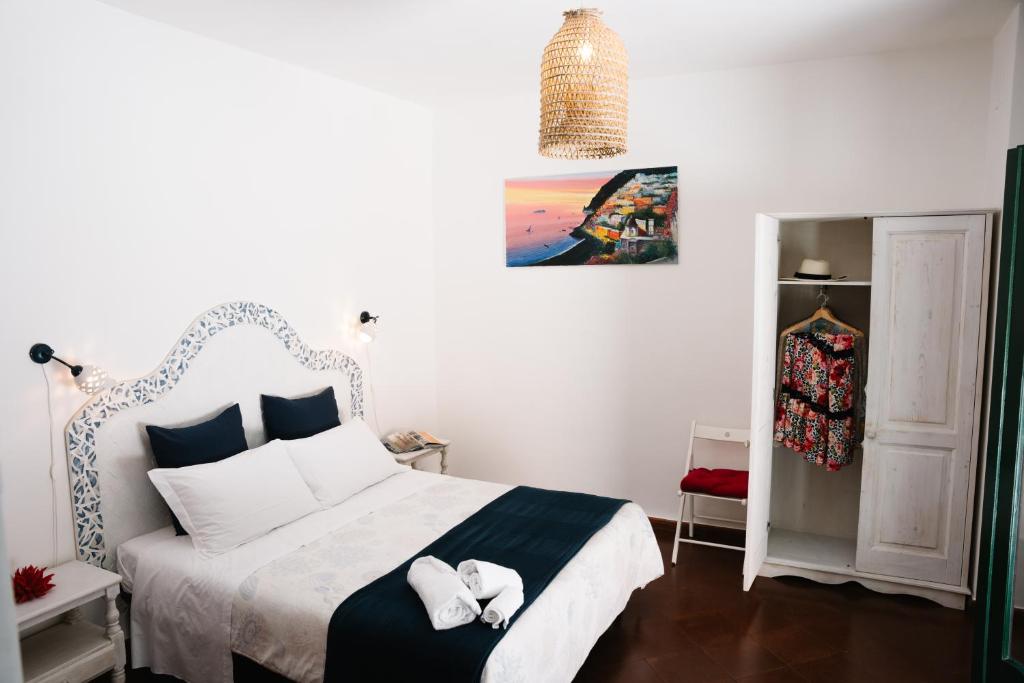 Postel nebo postele na pokoji v ubytování B&b DORMIDAME'