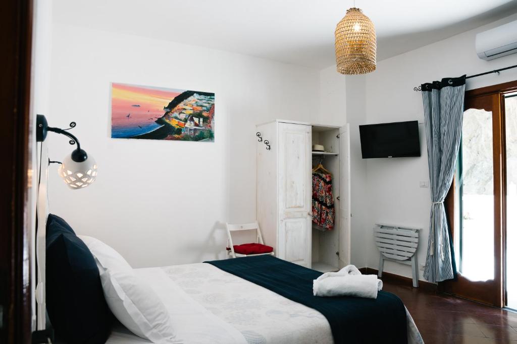 Postel nebo postele na pokoji v ubytování B&b DORMIDAME'