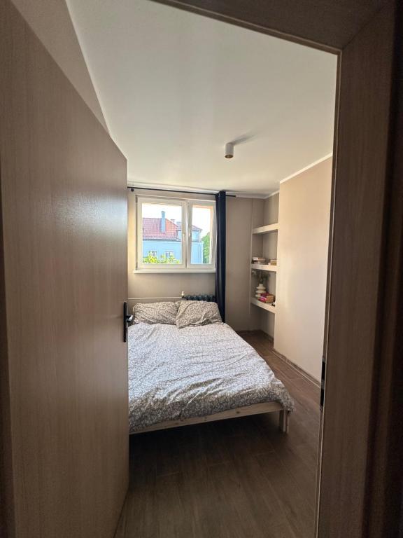 En eller flere senge i et værelse på Apartament MOCHA Szczytno Mazury