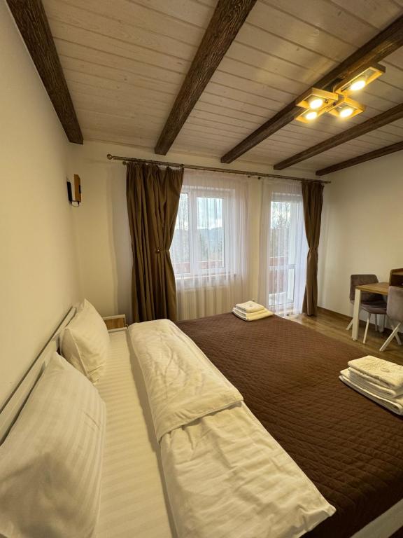 Postel nebo postele na pokoji v ubytování Kolos house