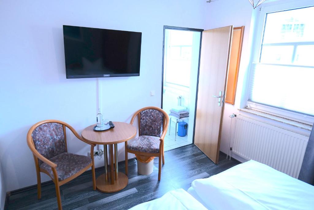 TV a/nebo společenská místnost v ubytování Hotel & Restaurant Am Bodden