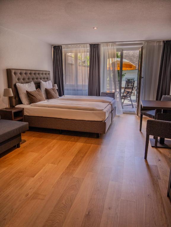 Postel nebo postele na pokoji v ubytování Hotel Baslertor