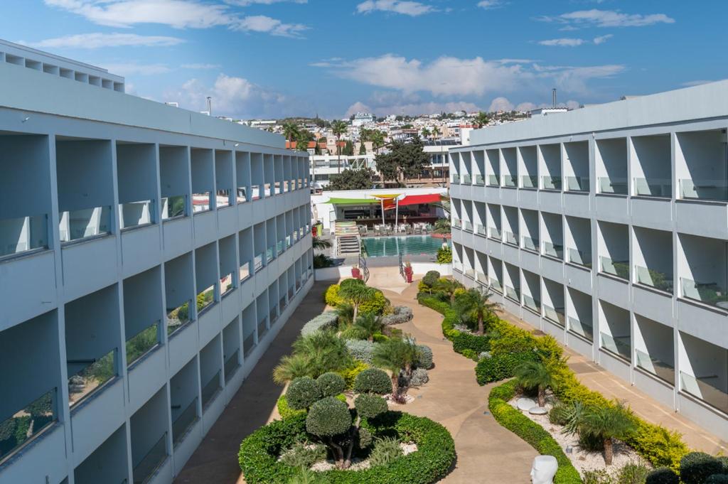 an overhead view of a building with a garden at Nicholas Color Hotel in Ayia Napa