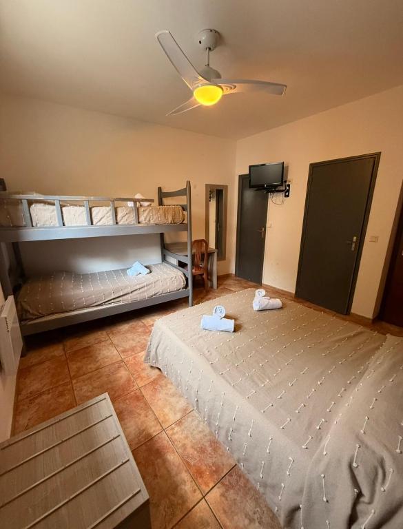 Postel nebo postele na pokoji v ubytování Hôtel - Pub Le Petit Bosquet