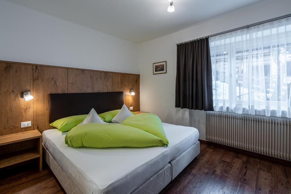 Postel nebo postele na pokoji v ubytování Garni Halali