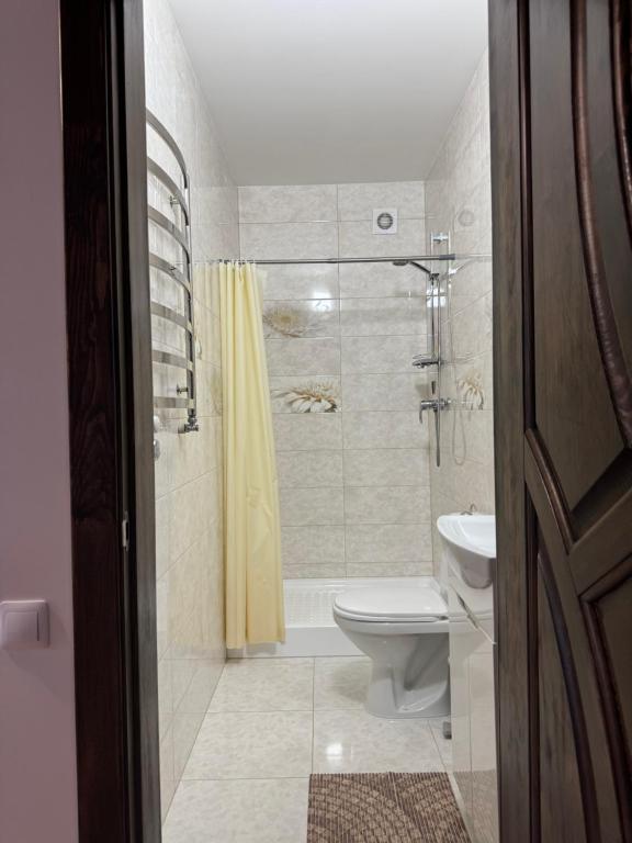 Koupelna v ubytování Kolos house