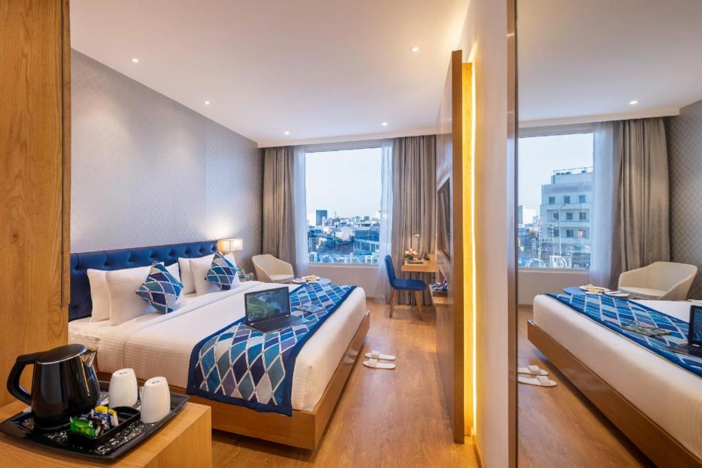 En eller flere senge i et værelse på SureStay by Best Western Model Town Amritsar