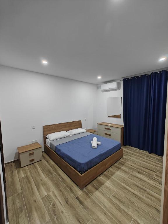 Ένα ή περισσότερα κρεβάτια σε δωμάτιο στο Large Deluxe Apartment