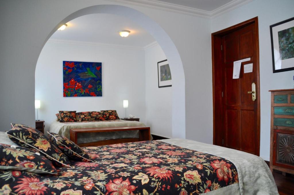Postel nebo postele na pokoji v ubytování Boutique Hotel Casa Foch