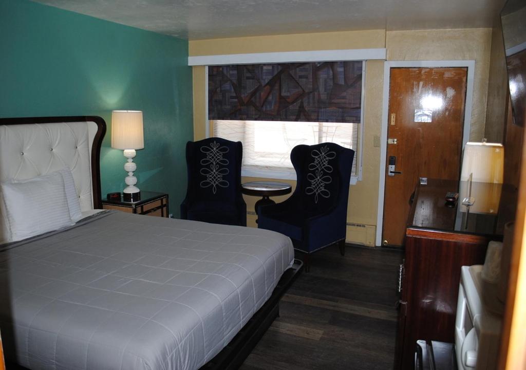 Postel nebo postele na pokoji v ubytování American inn
