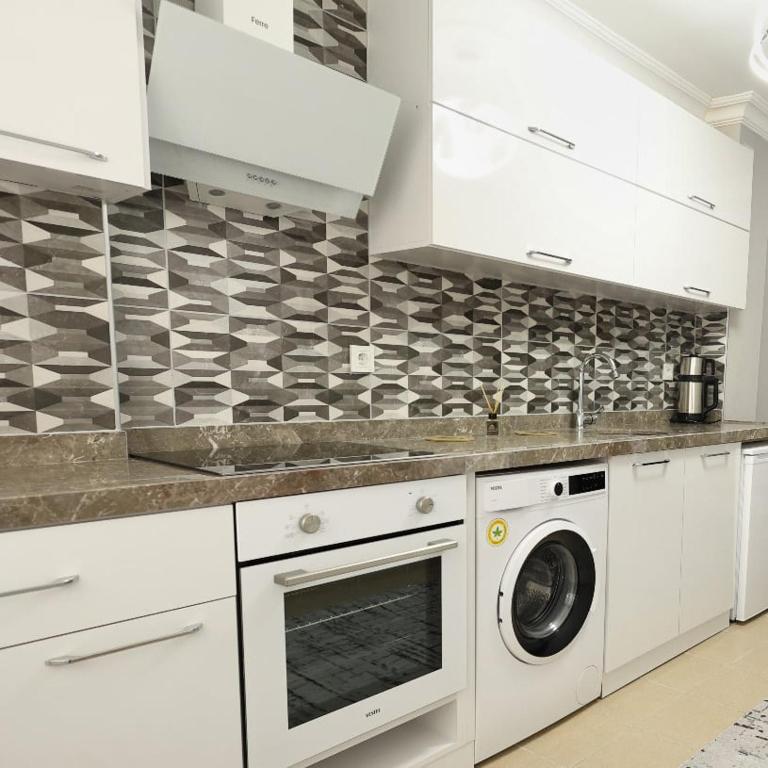 Kuchyň nebo kuchyňský kout v ubytování Golden Homes