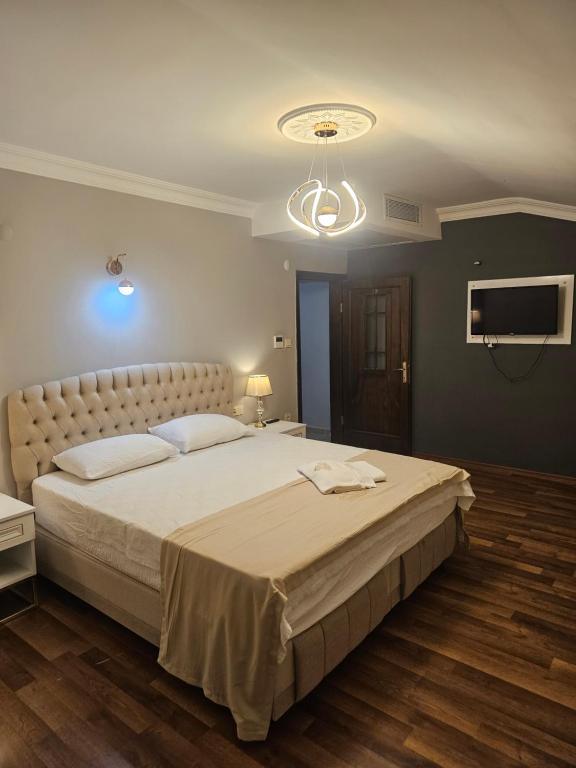 Postel nebo postele na pokoji v ubytování Golden Homes