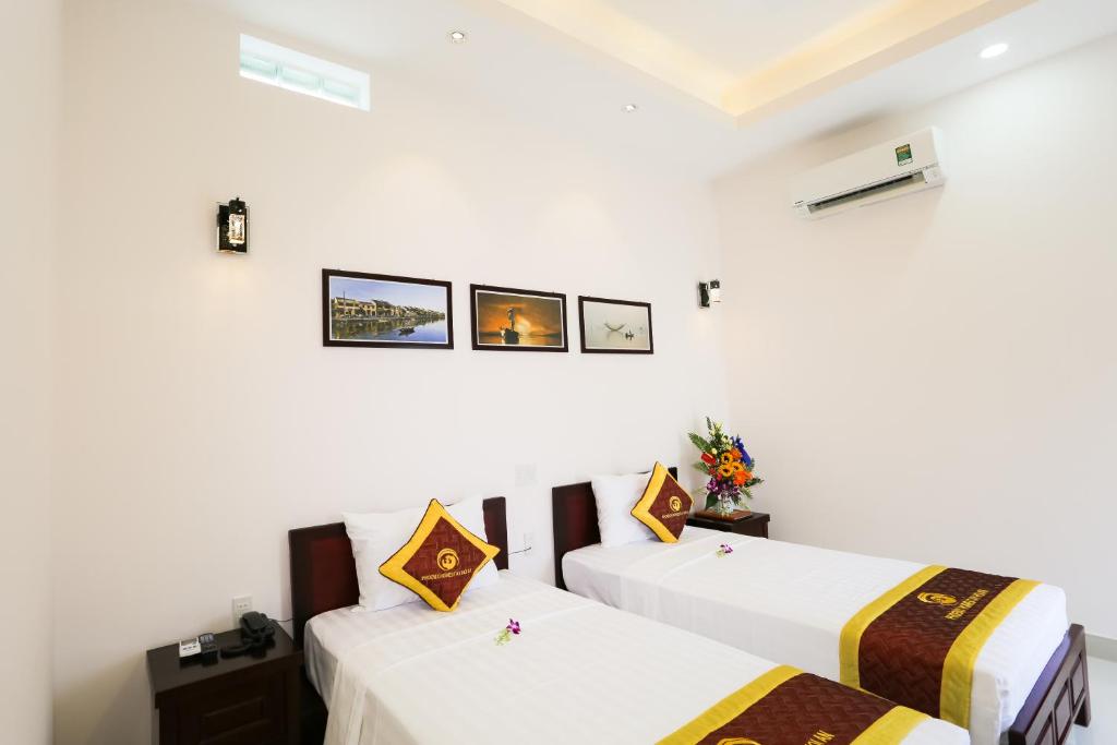 Postel nebo postele na pokoji v ubytování Phoenix Homestay
