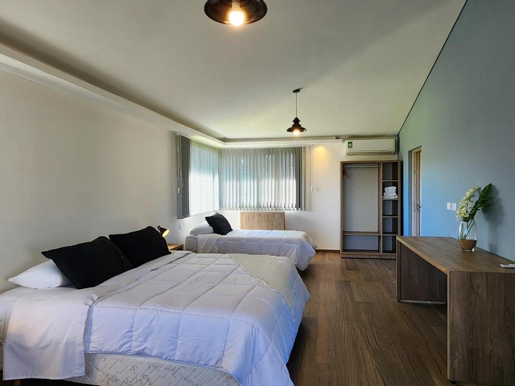 Postel nebo postele na pokoji v ubytování Irupé Lodge