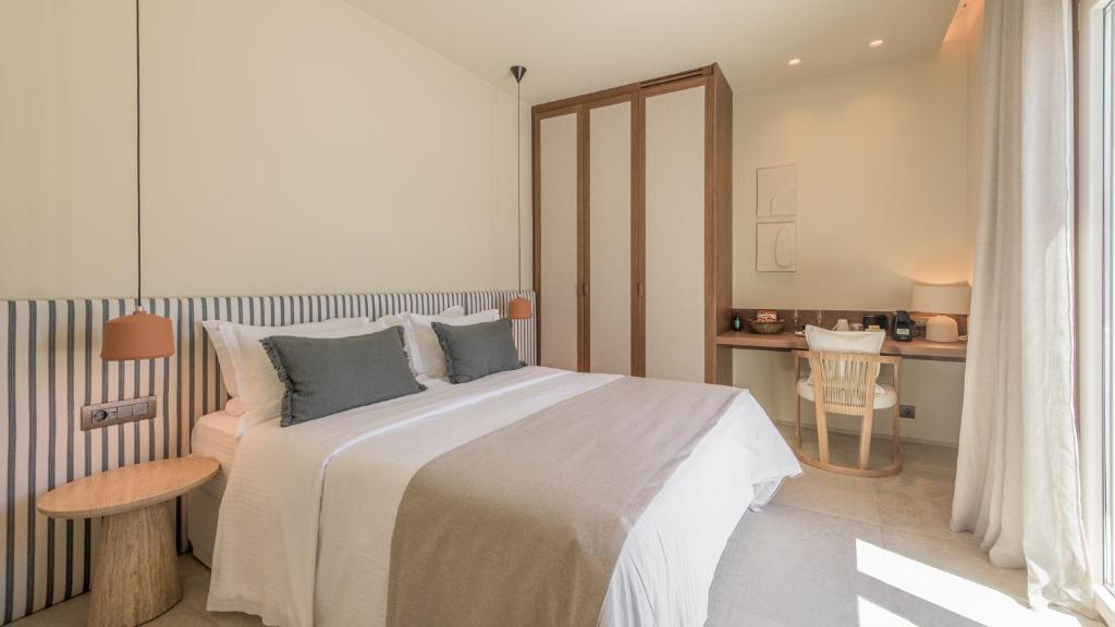 Postel nebo postele na pokoji v ubytování Hotel Eleni