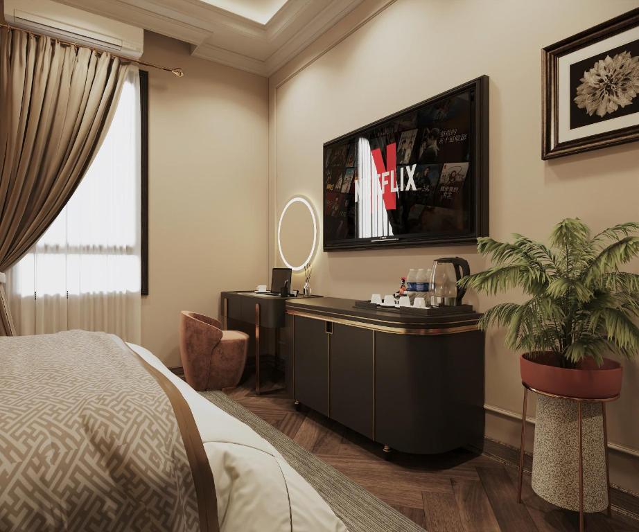TV a/nebo společenská místnost v ubytování San Hotel & Pool