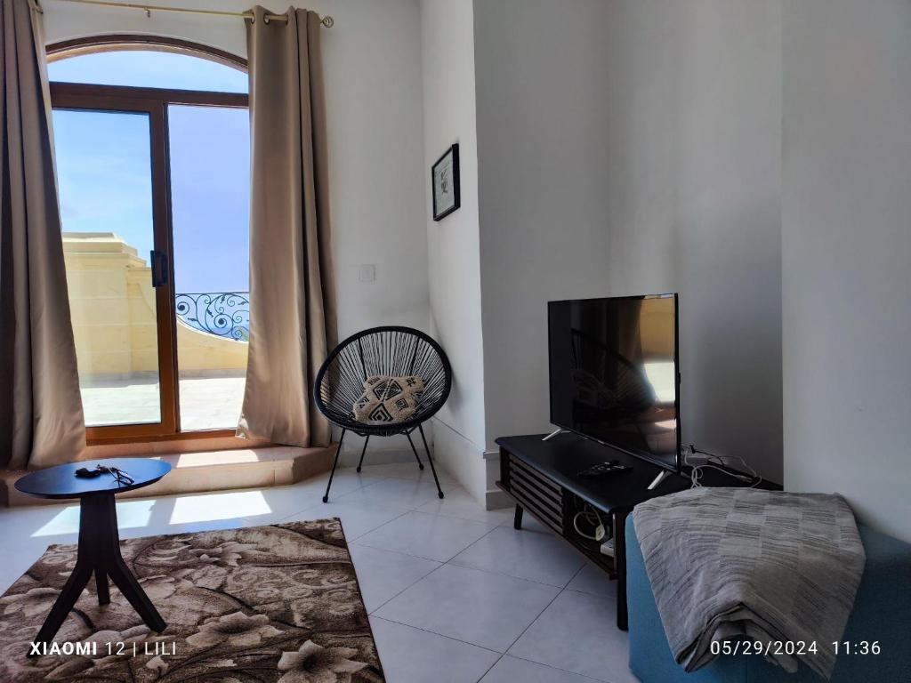 TV a/nebo společenská místnost v ubytování Penthouse Views