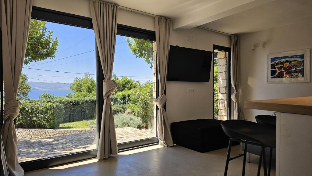 a room with a large window with a view at Val Mar in Novi Vinodolski