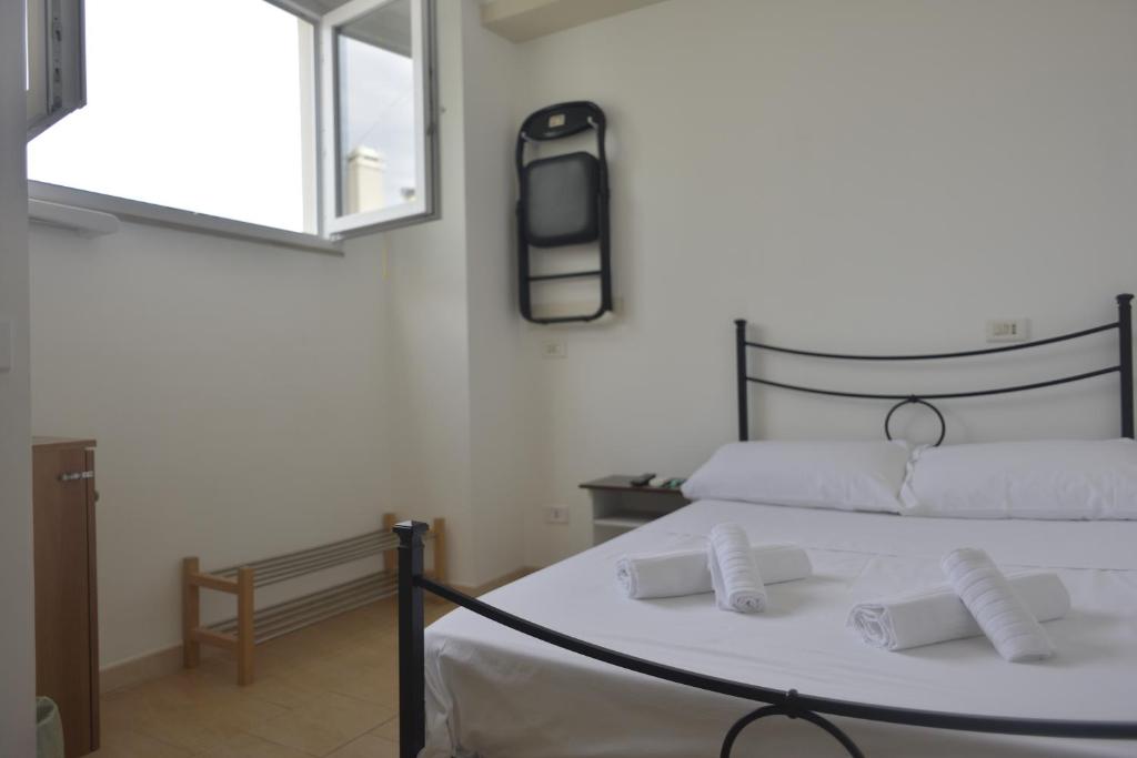 Postel nebo postele na pokoji v ubytování Casa Nannì