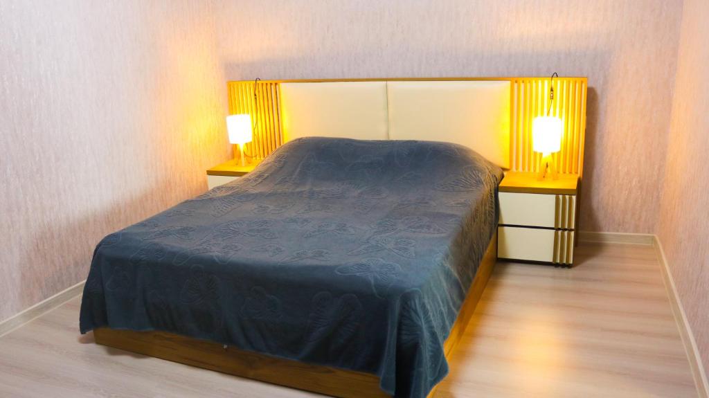 Postel nebo postele na pokoji v ubytování Susannas Apartment with Panoramic Mountain View