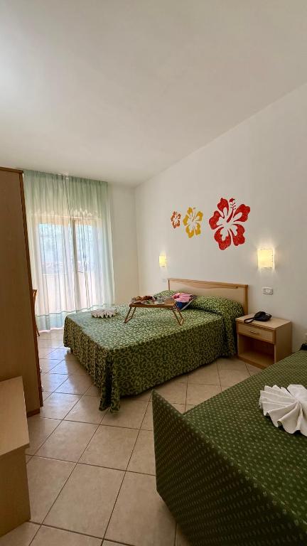 Letto o letti in una camera di Ibisco Hotel