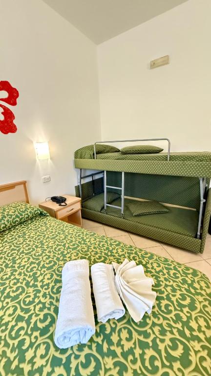 Letto o letti in una camera di Ibisco Hotel
