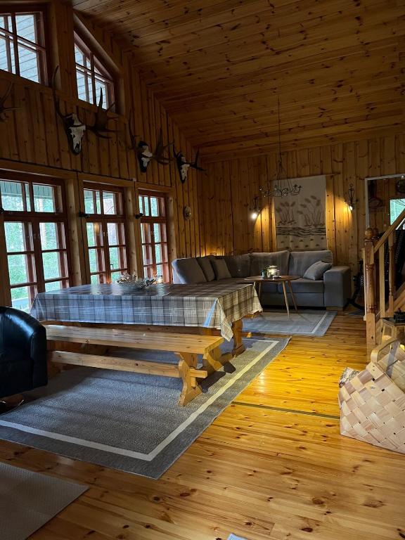 a living room with a bed and a couch at Hölmölä in Salo